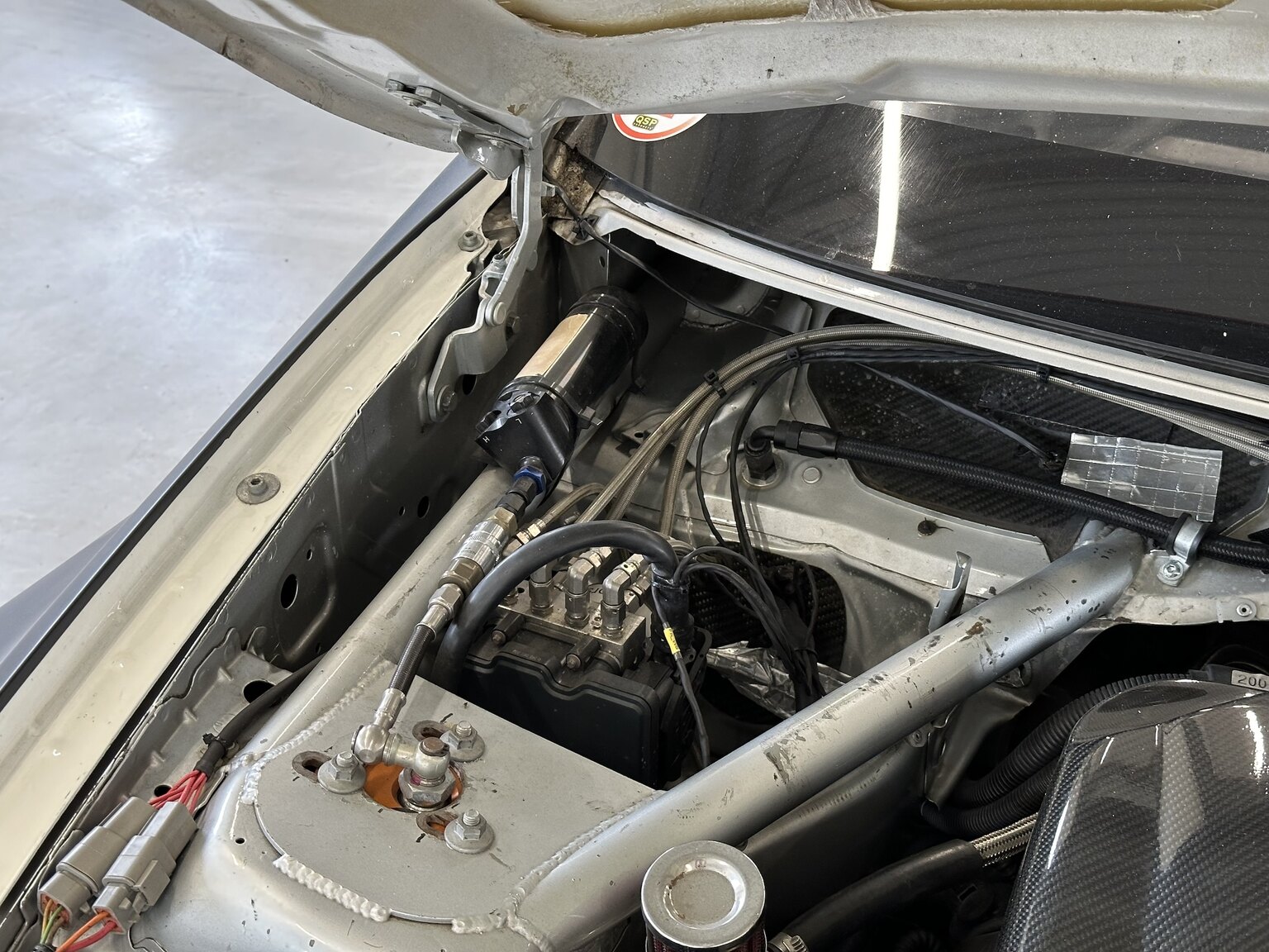 Image of 2012 BMW M140 Race Car mechanics